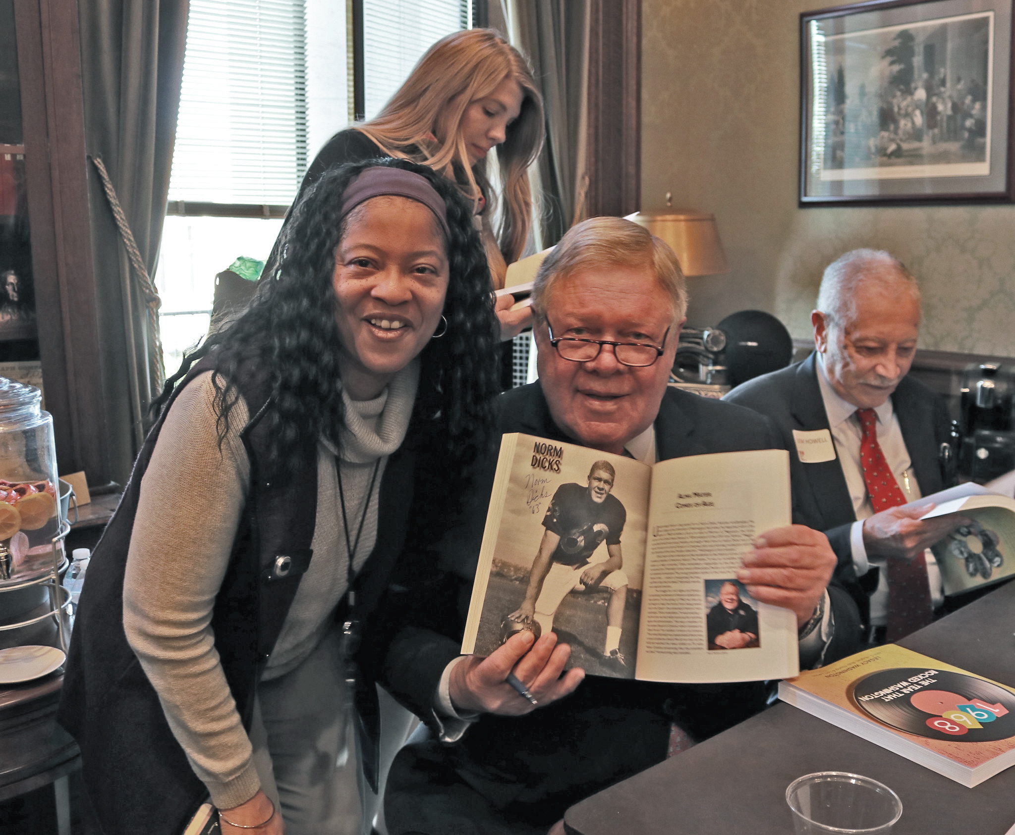 Legacy WA Books - man and woman, author holding book