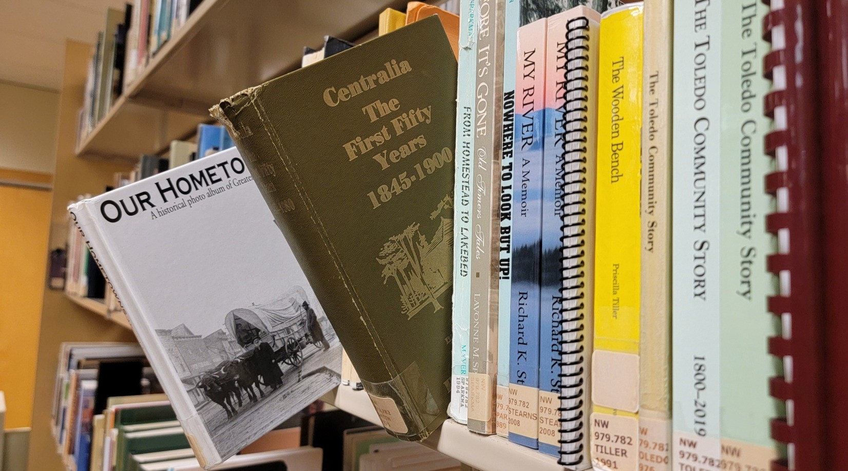 Washington State Library books on bookshelf.